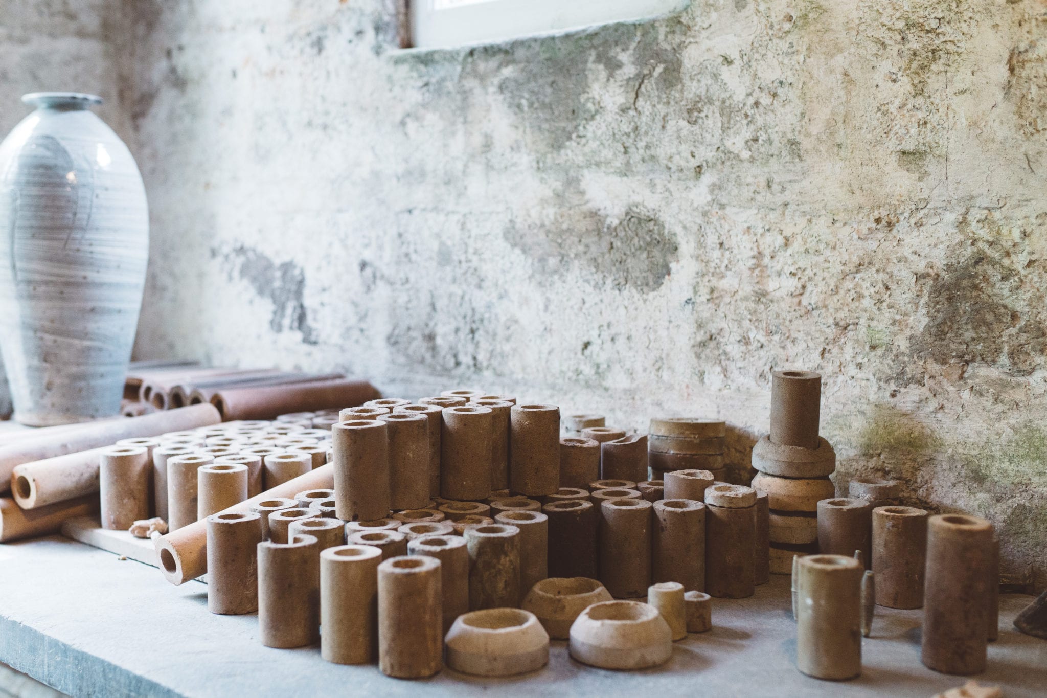 A collection of clay vessels ready to be fired