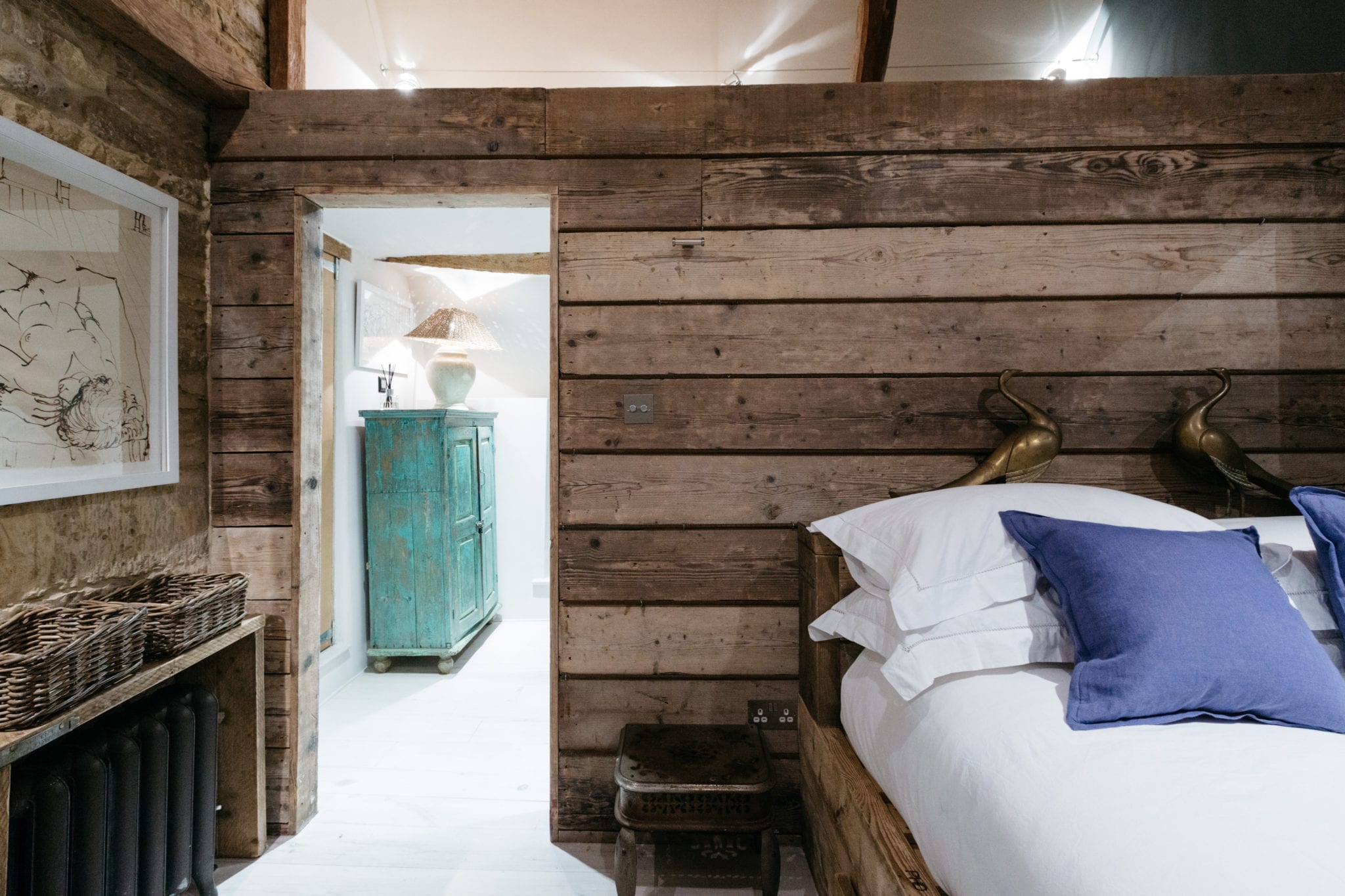 Bedroom with wooden clad walls