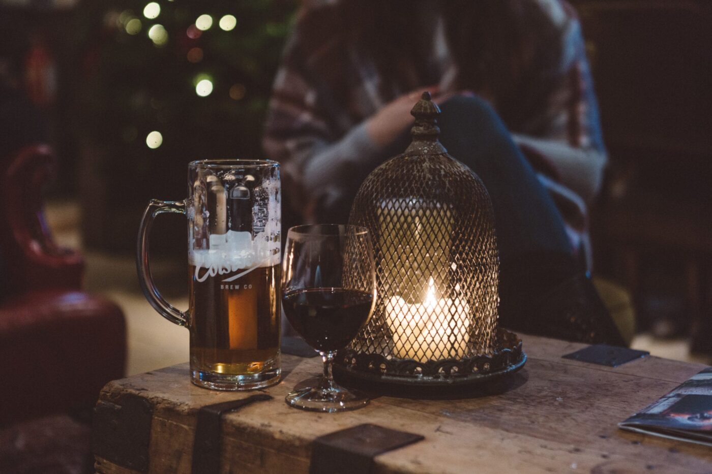 A pint of local Cotswolds lager by a cosy candle