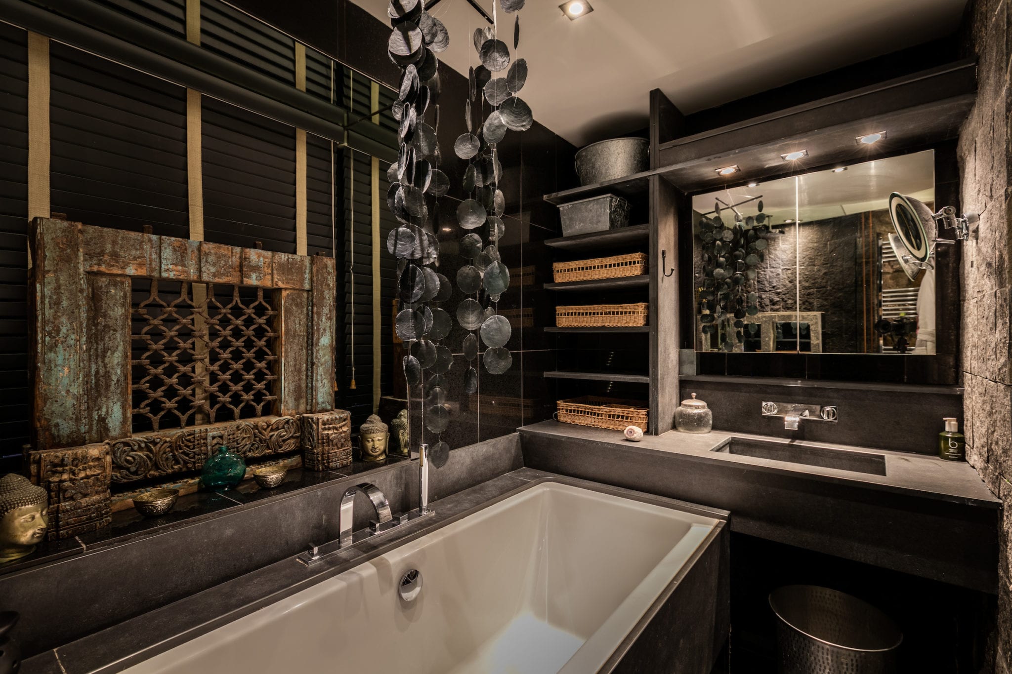 A black granite bathroom with moroccan features