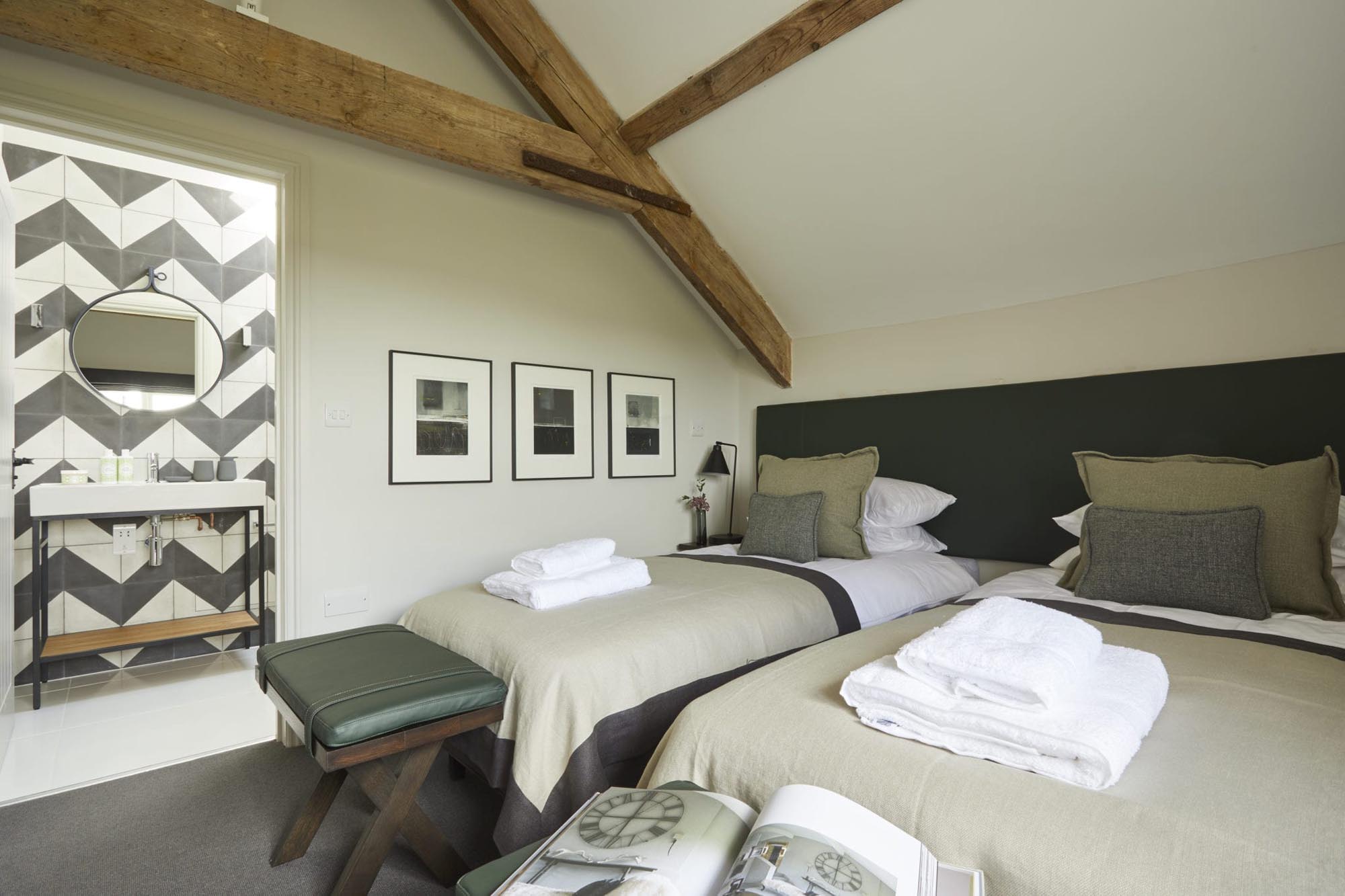 The Stables twin bedroom with artwork