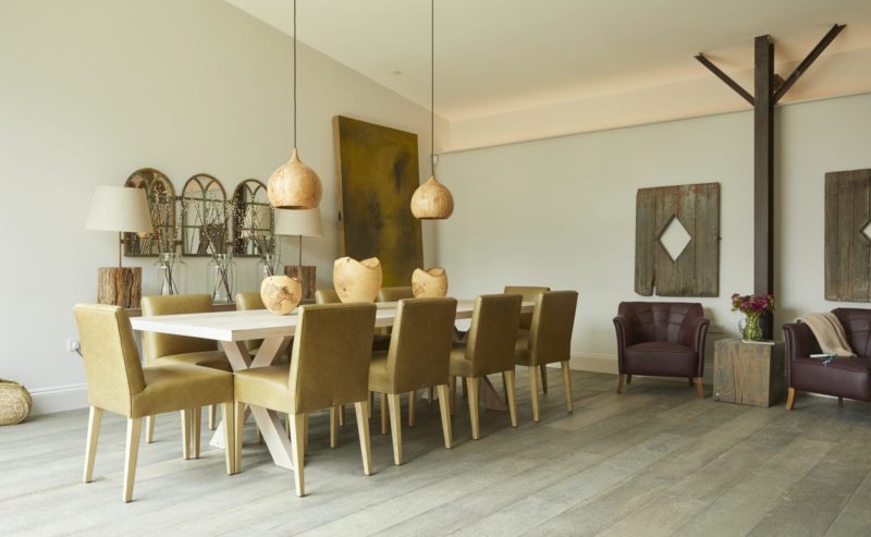 Bull Pen barn conversion dining area with hanging lamp shades