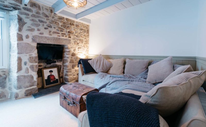 Cosy snug sofa living area in coxswain's cottage