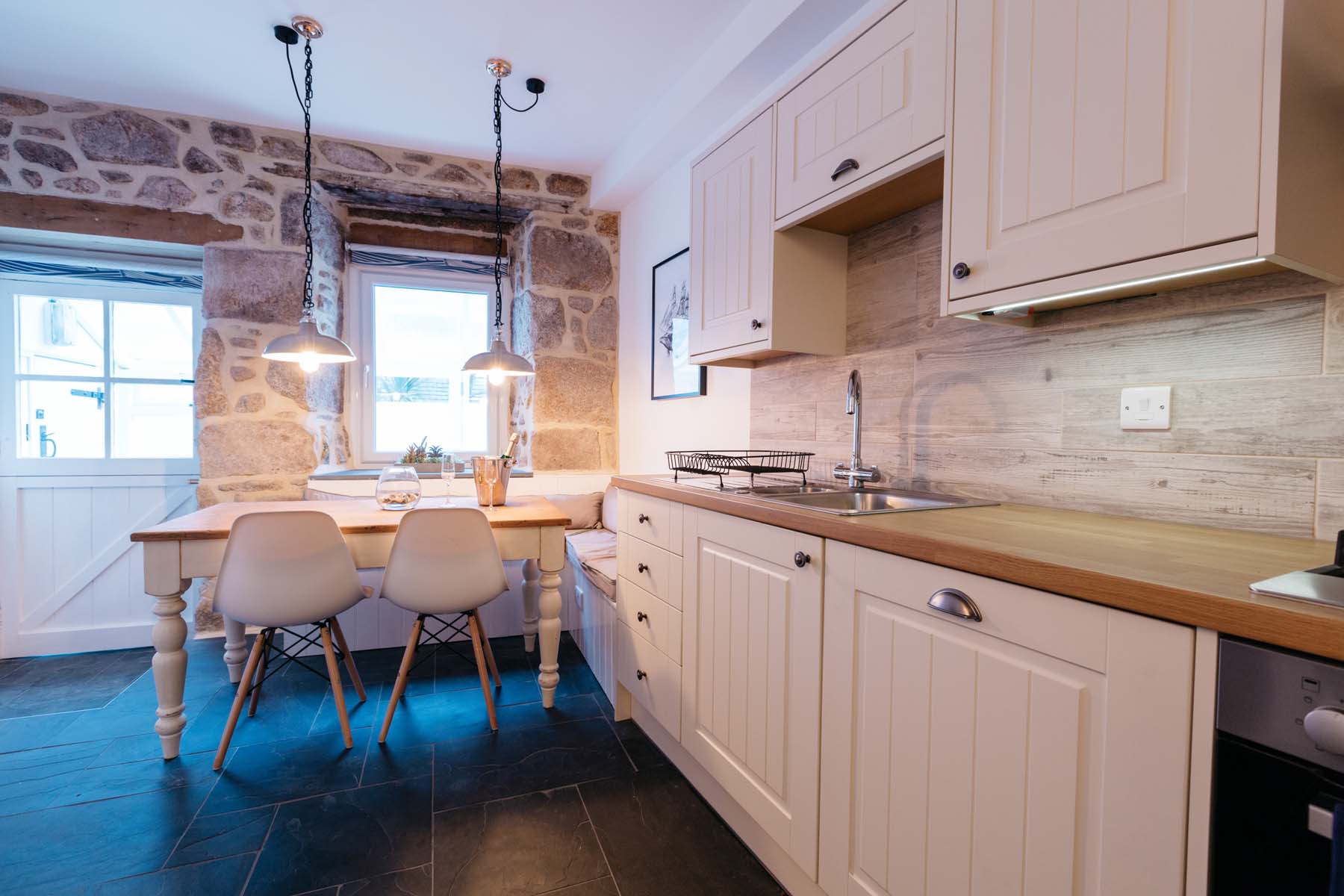 Contemporary open plan kitchen dining area Coxwain's Cottage