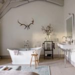 Bedroom with a white rolltop bath tub