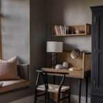 Room with window seat and corner desk