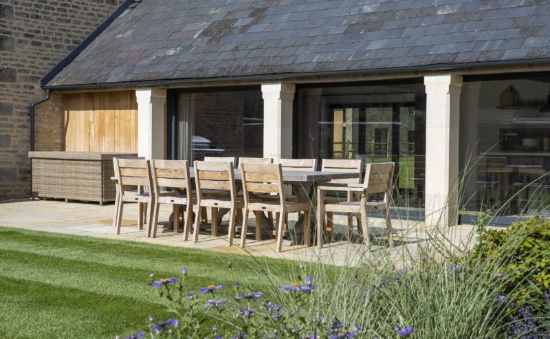 the grain store cotswolds garden outdoor dining sun