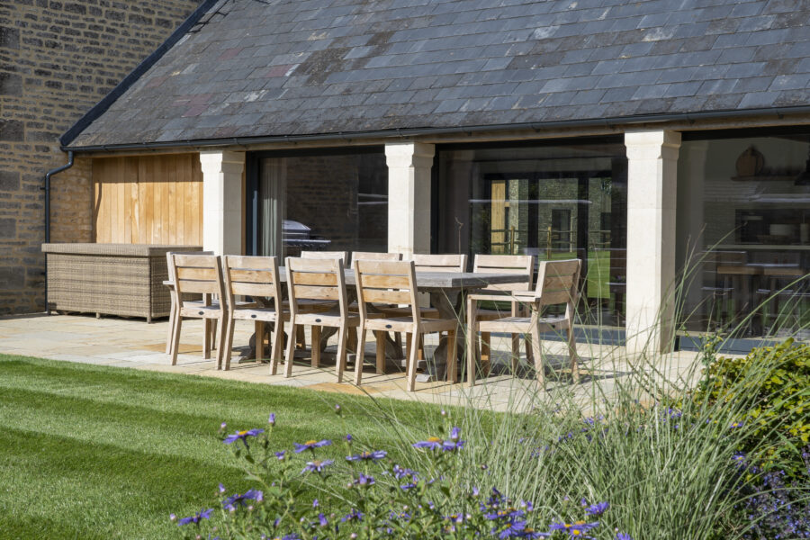 the grain store cotswolds garden outdoor dining sun
