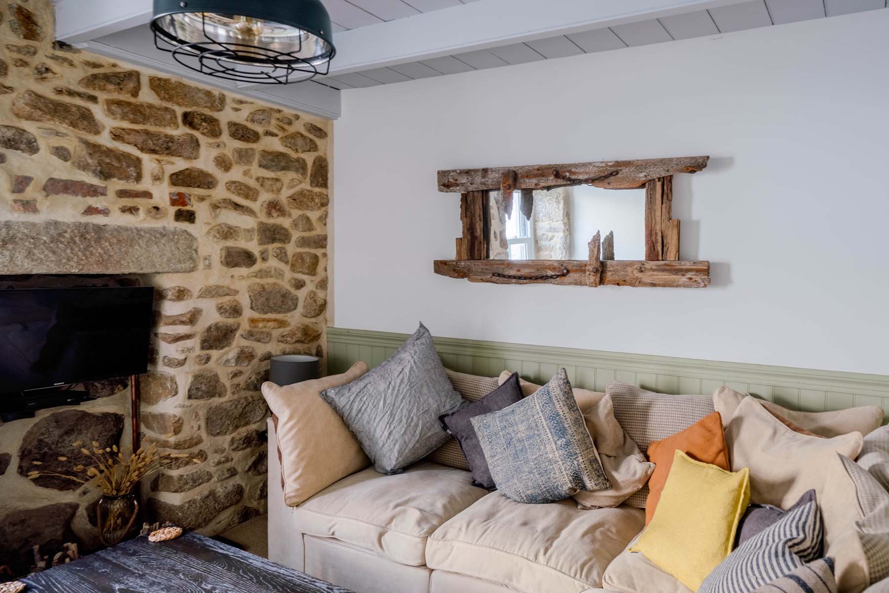 Living room with exposed stone walls