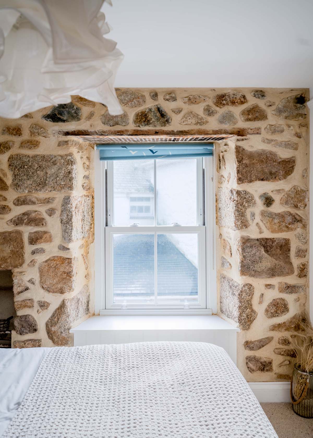 Window in exposed stone wall