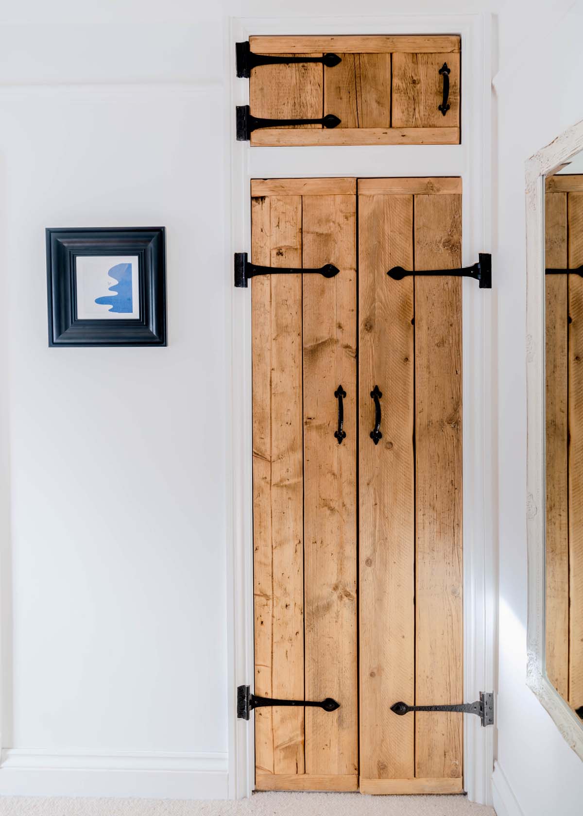 Wooden cupboard door with iron hinges