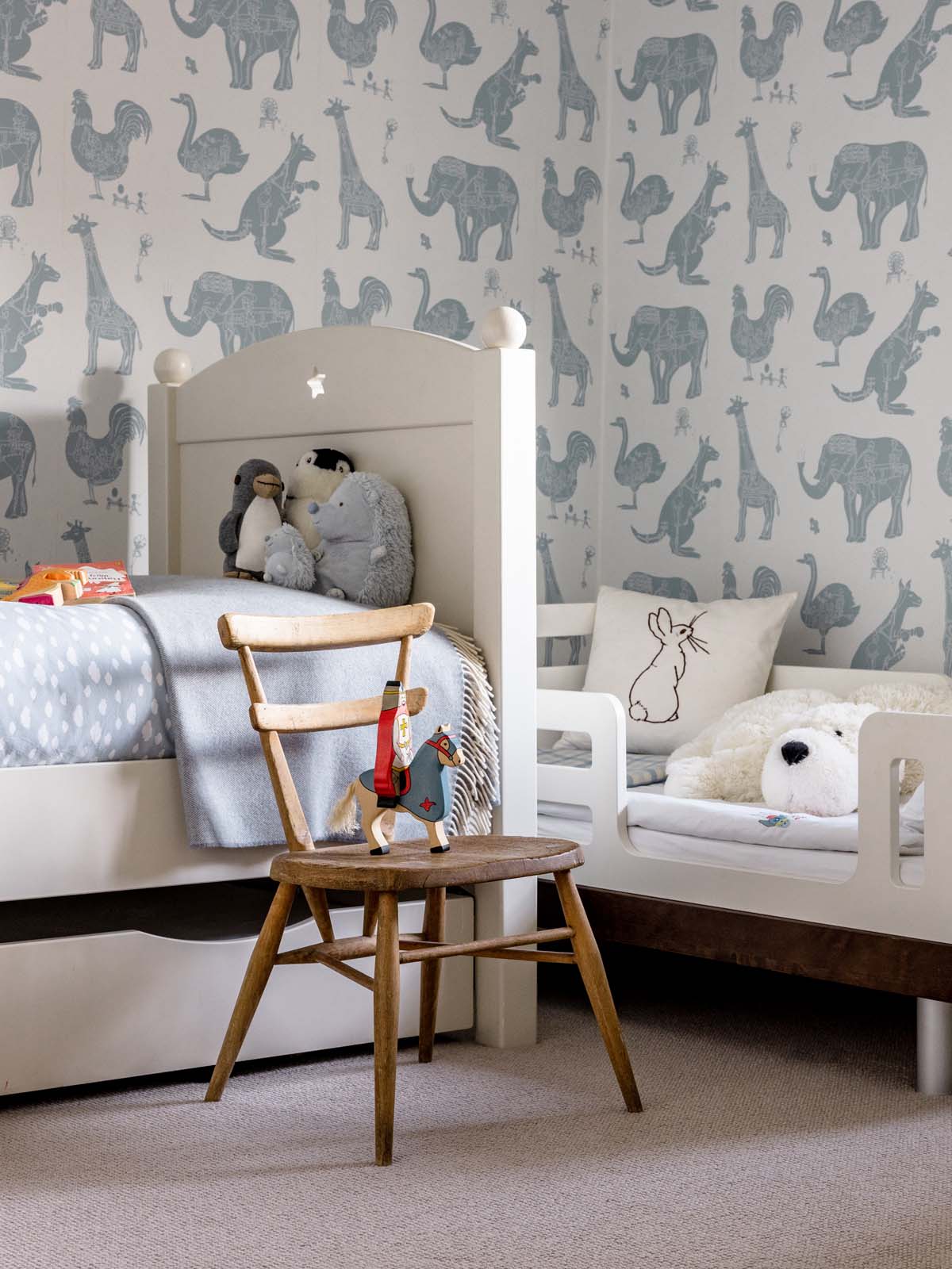 Children's bedroom with animal pattern wallpaper