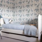 Children's bedroom with patterned wallpaper