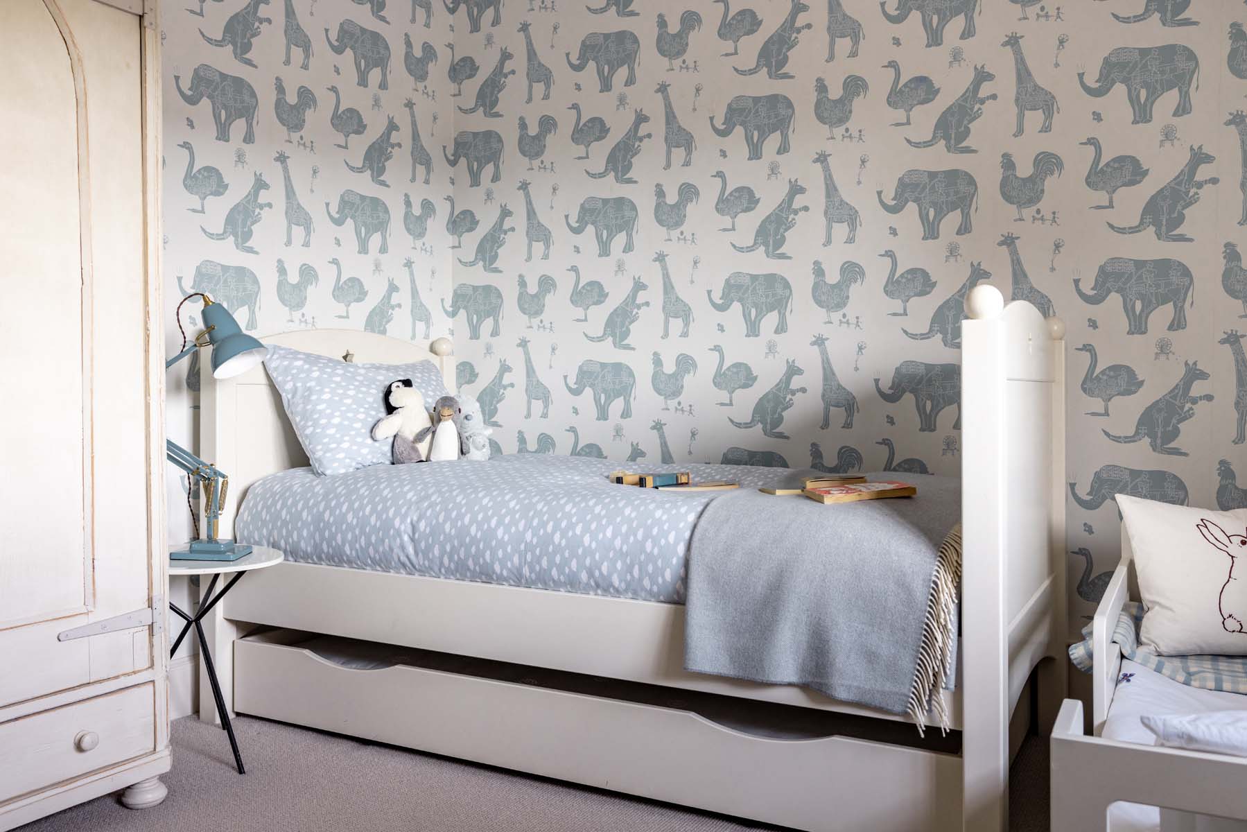 Children's bedroom with patterned wallpaper