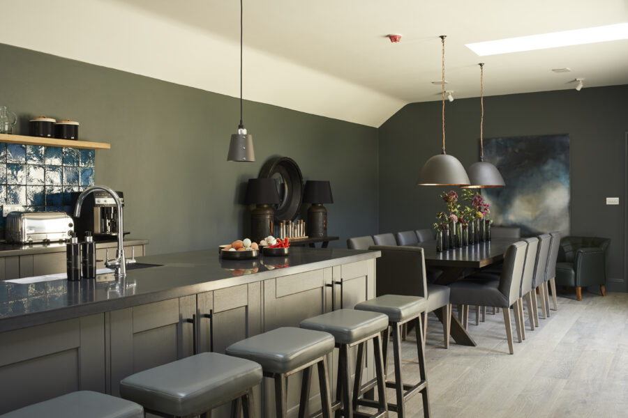 Kitchen island with bar chairs and dinner table