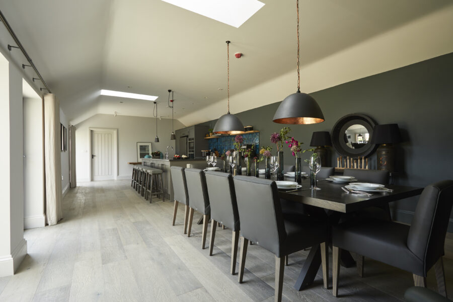 Dinner table with large kitchen and kitchen island