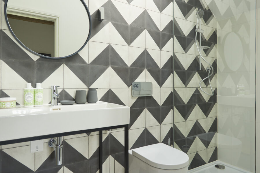 Bathroom with large sink and walk in shower