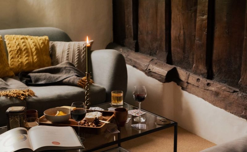 Cosy living room snug with glass of wine and cheese