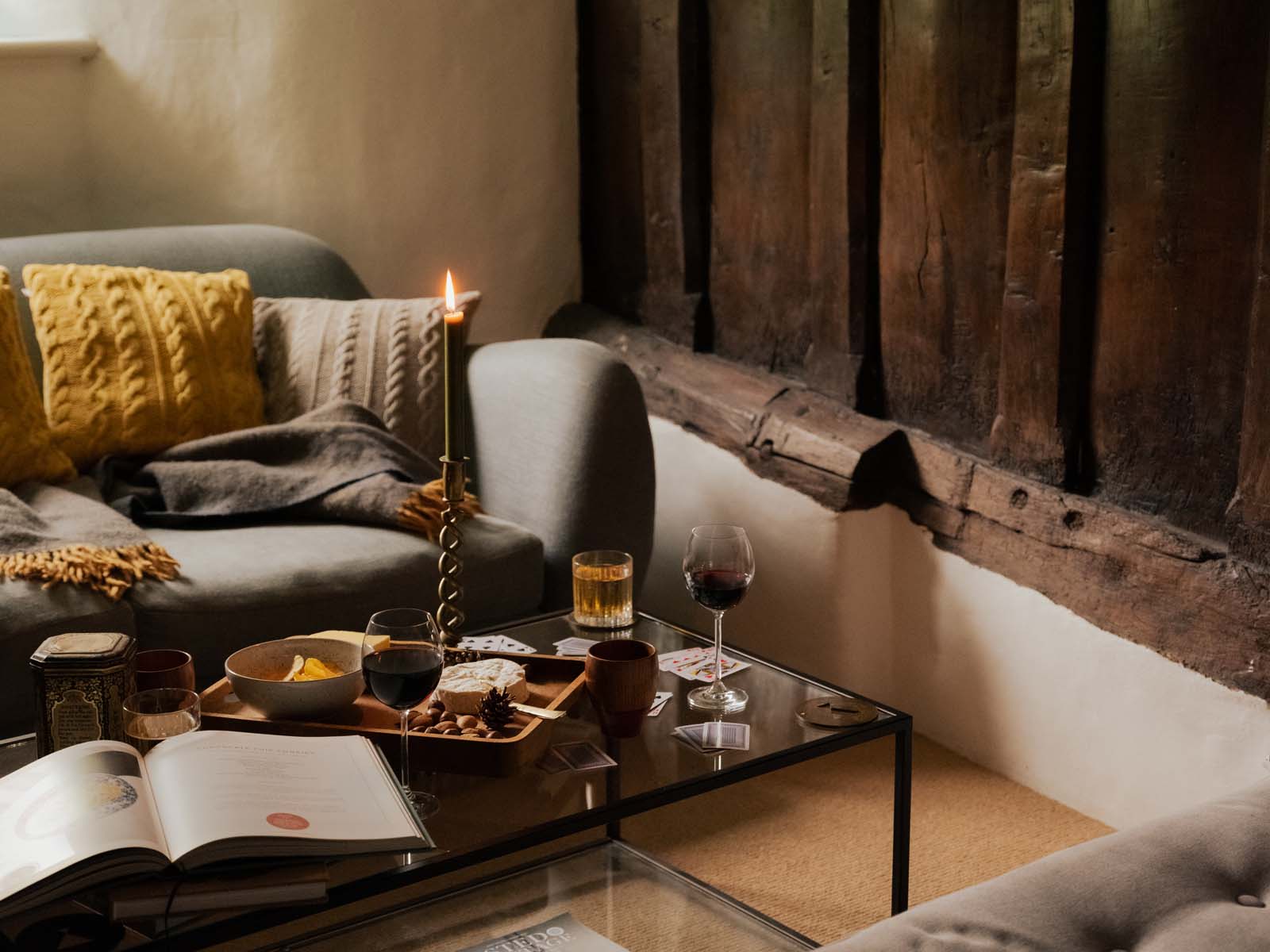 Cosy living room snug with glass of wine and cheese