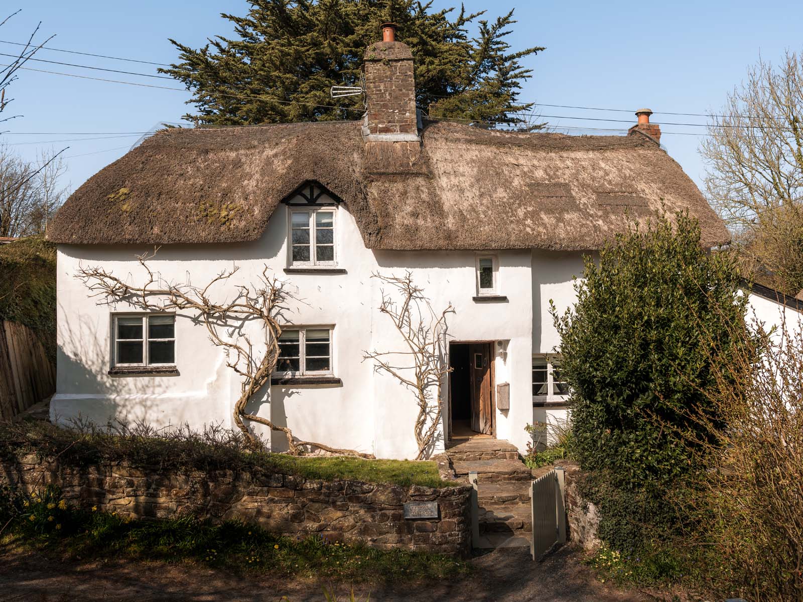 The front exterior of the cottage in the sun