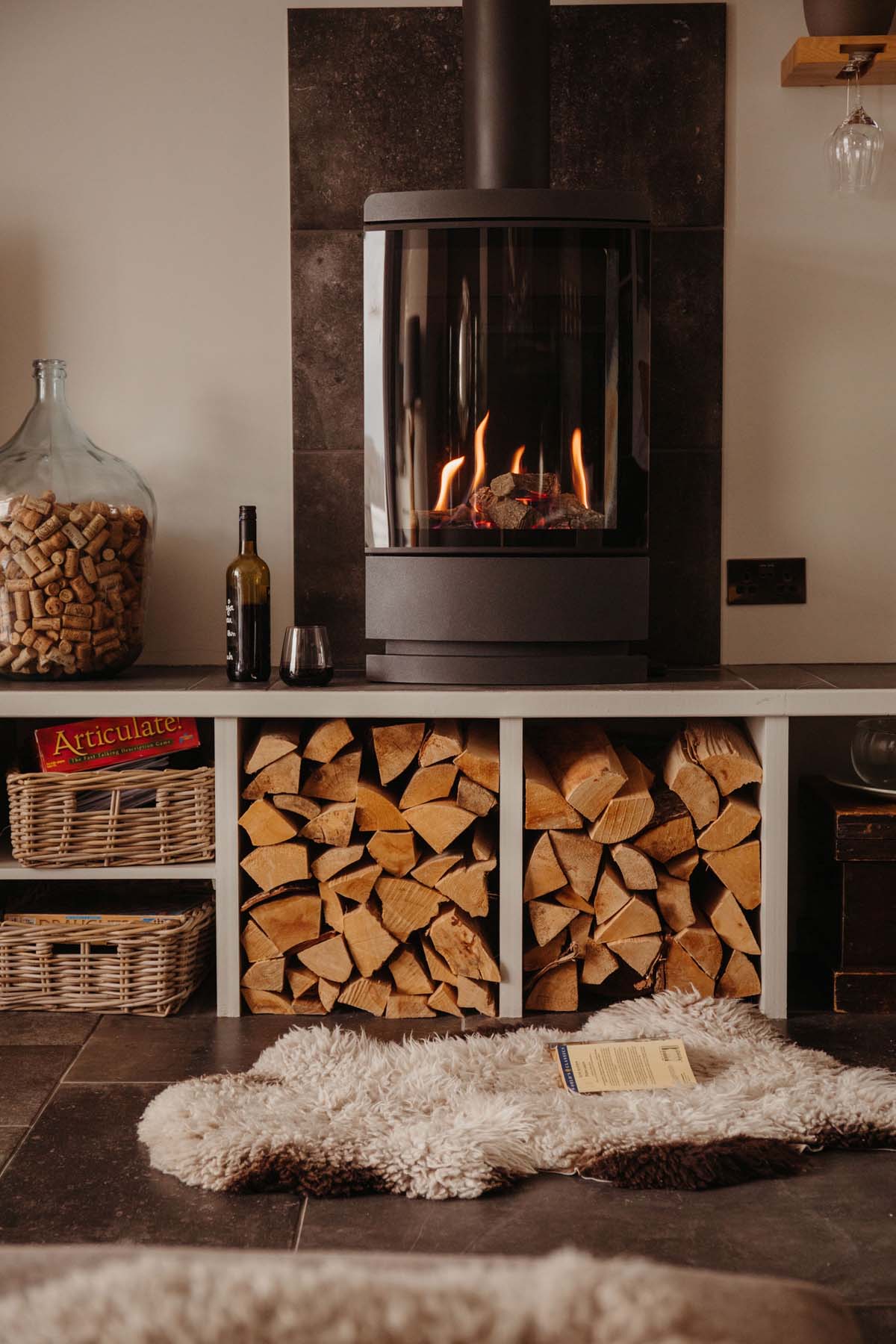 Modern wood burning stoves with logs stored in cubby holes