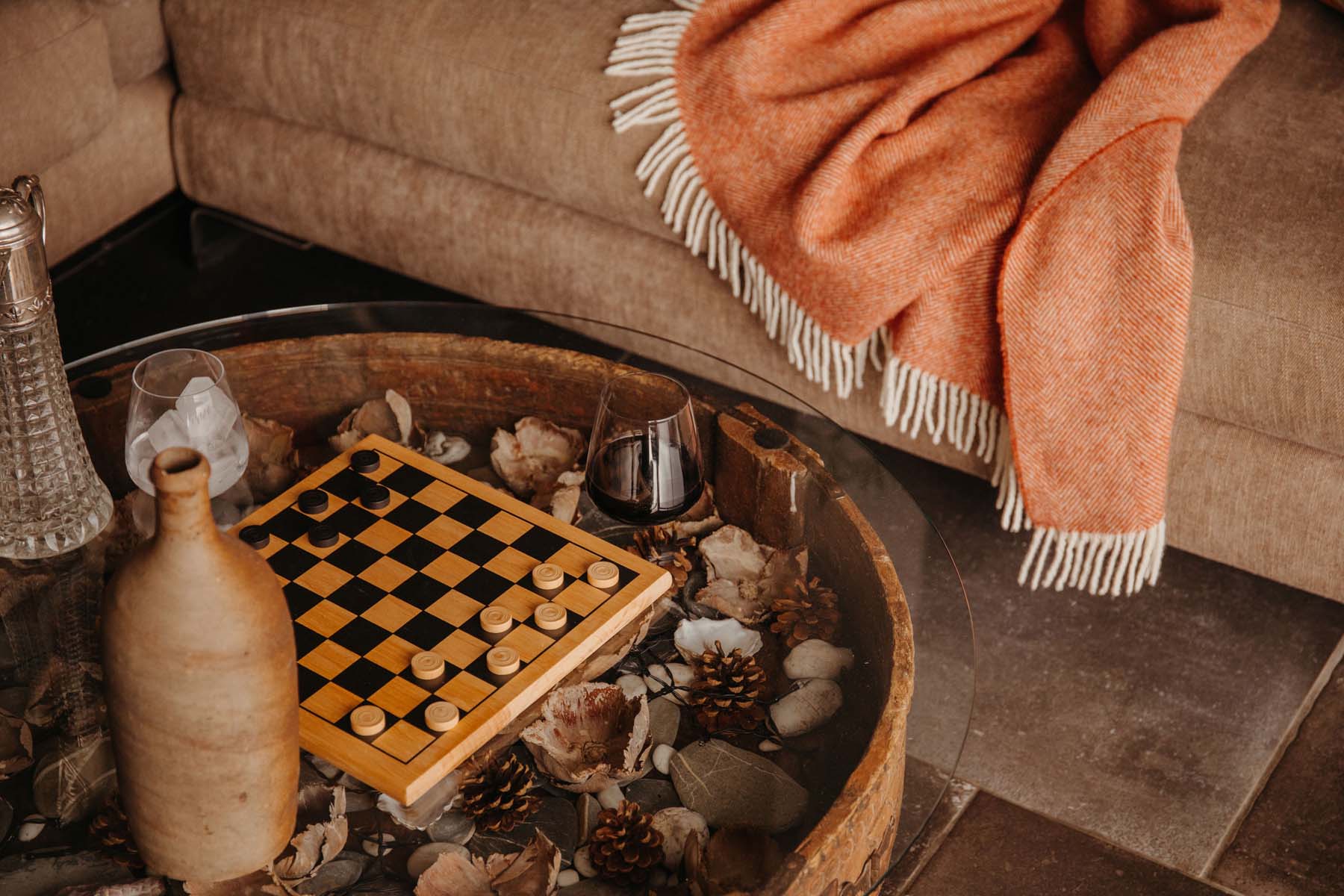A chess board on a glass coffee table