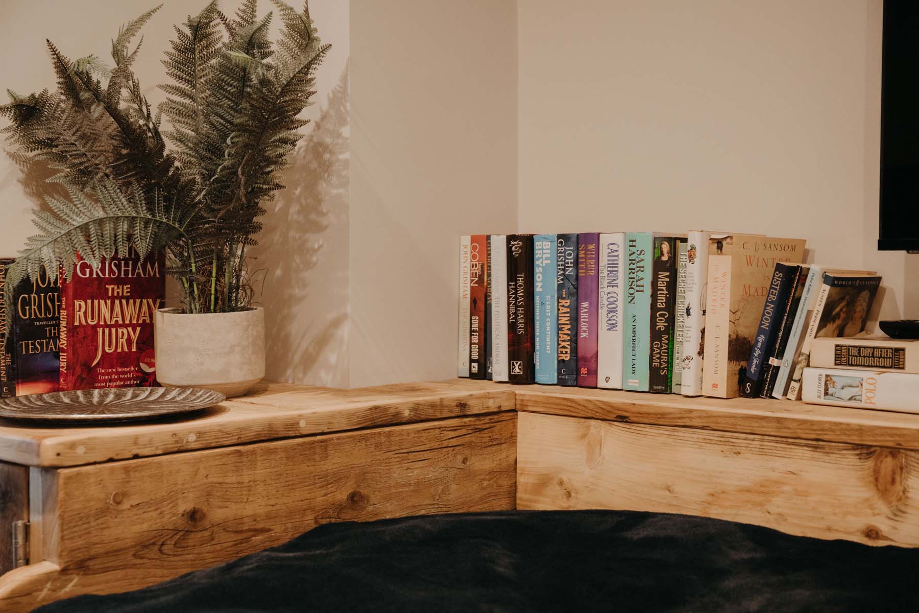 Books on a wooden shelf