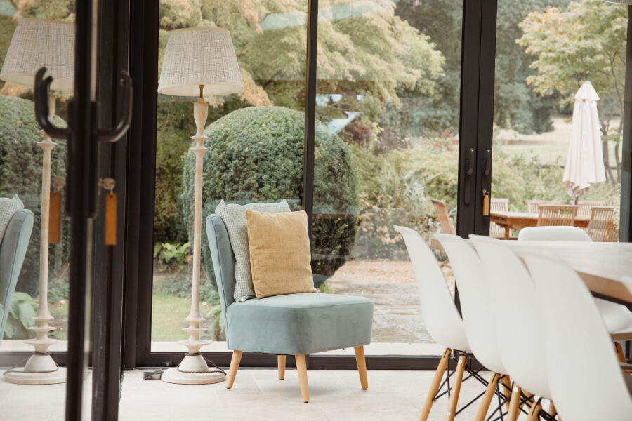 large window sun room with views of the garden