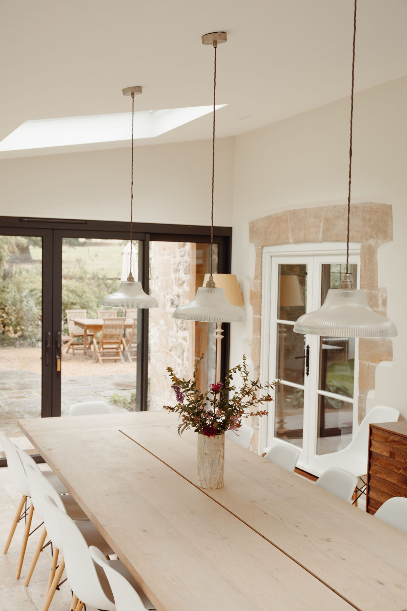 Dining table area in extension of the house with a skylight