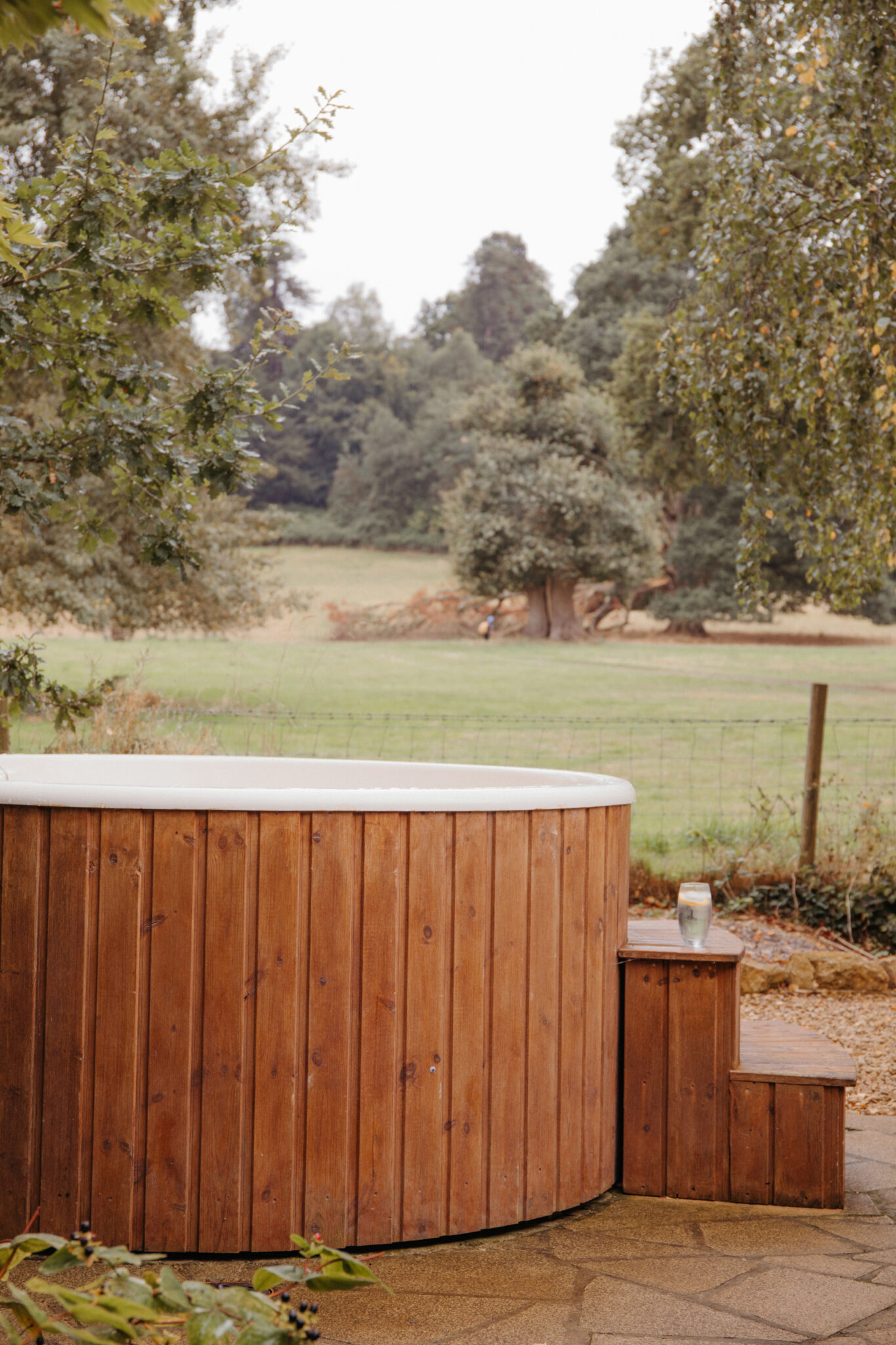 A wooden hot tub in the countryside