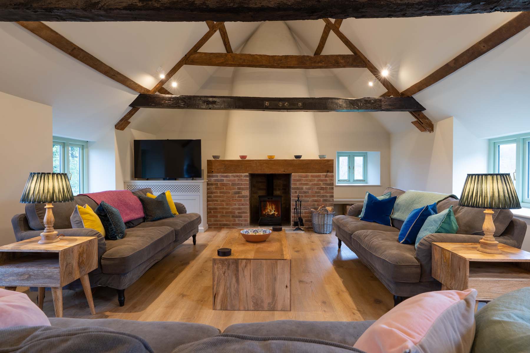 Cosy living room with wooden beams and log burner