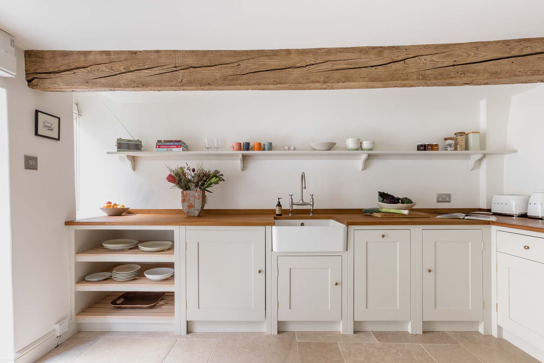 Minimal white shaker style cottage kitchen with wooden beams