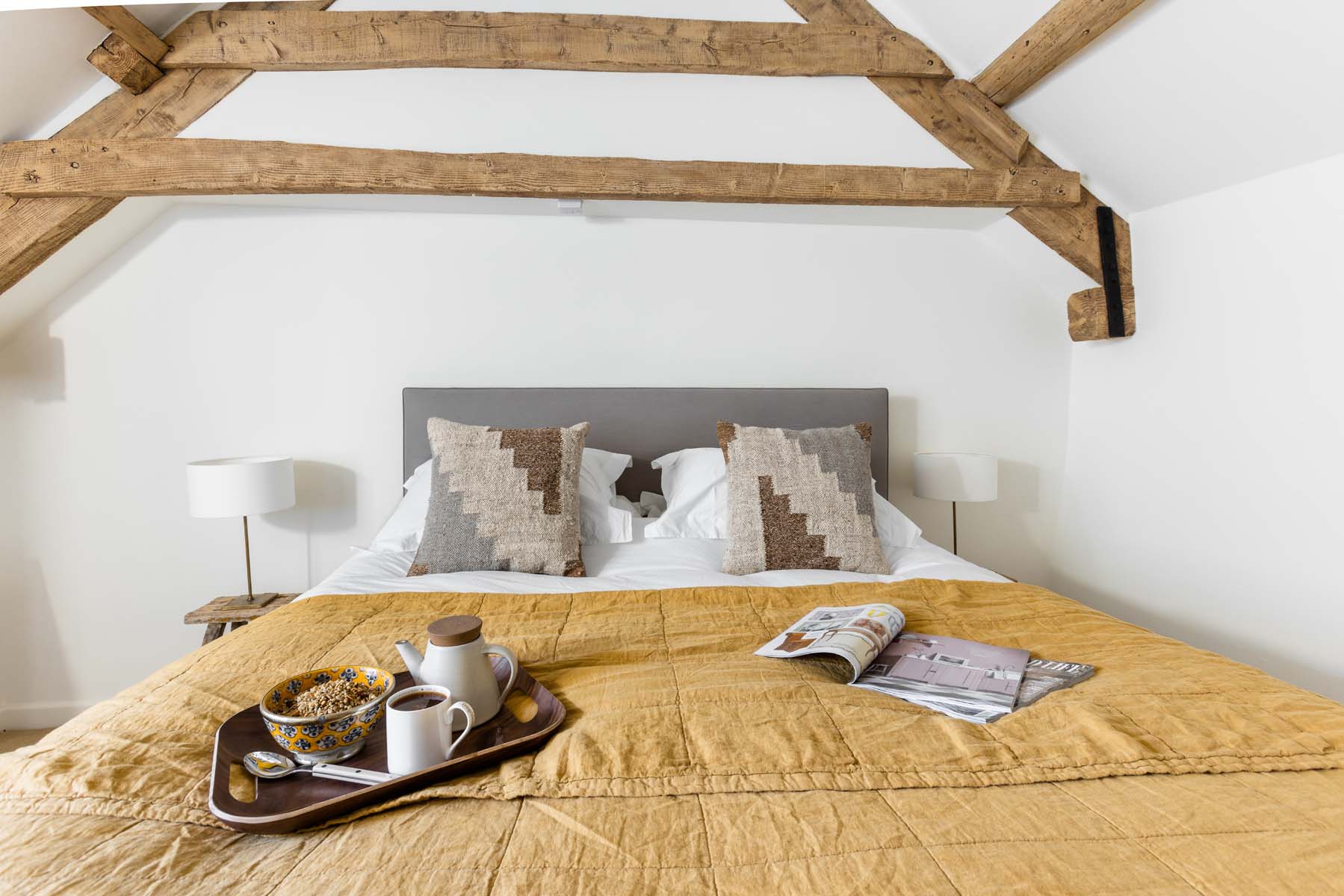 Breakfast and magazines in bed at Stone Cottage