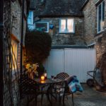 A cottage courtyard at dusk