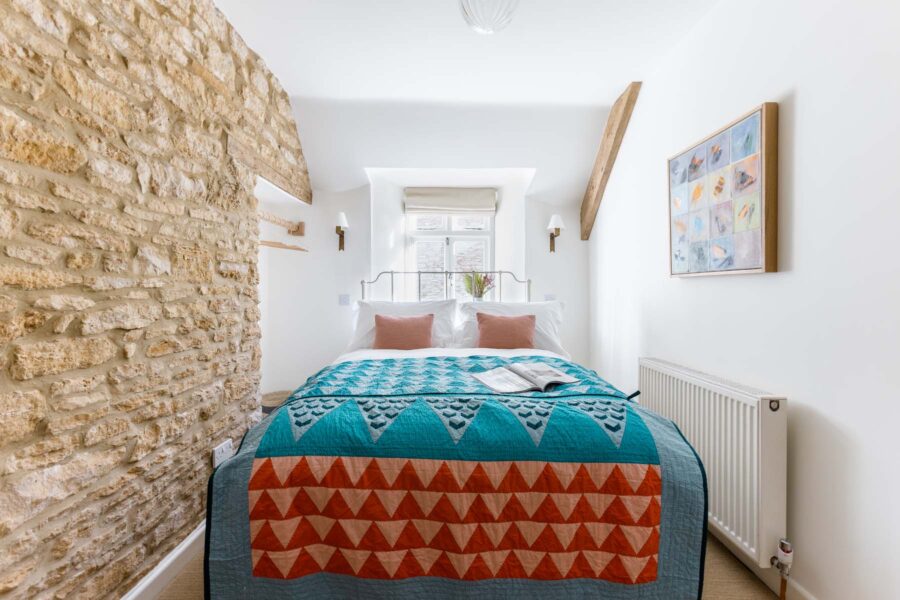 Double bedroom with an exposed brick wall
