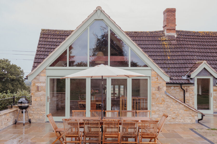 Exterior of a large stone house with a large apex