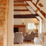 Sitting room with high ceilings and wooden beams