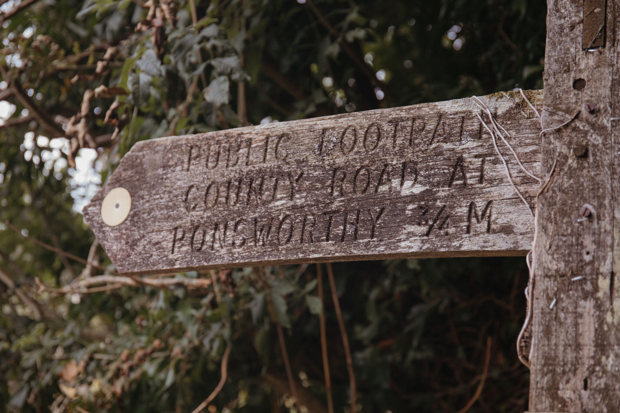 Old wooden countryside sign