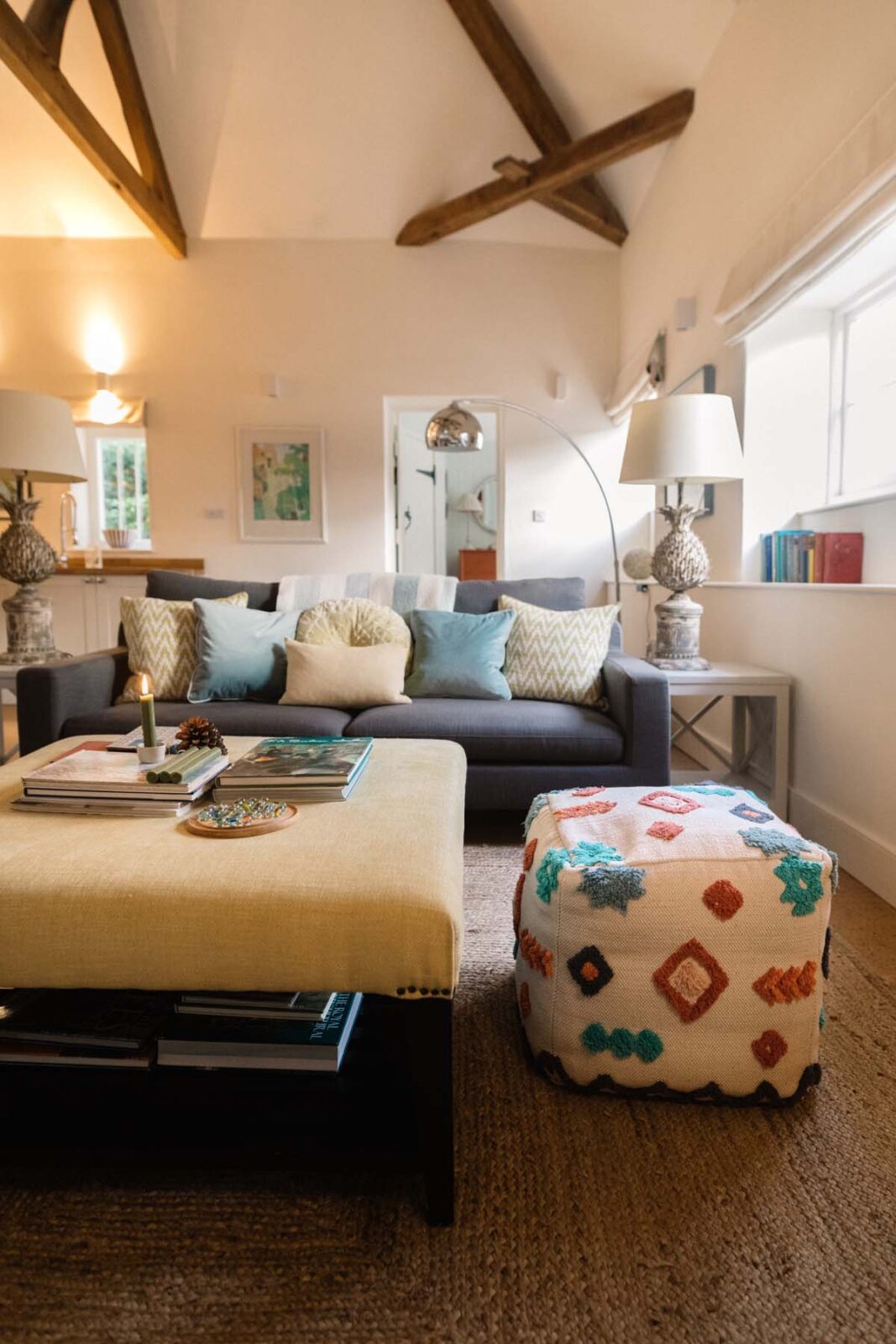 Open plan living room with colourful furnishings