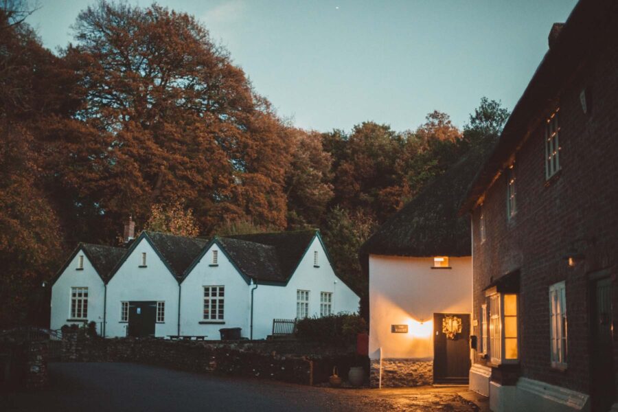 Cosy autumn village with thatched houses