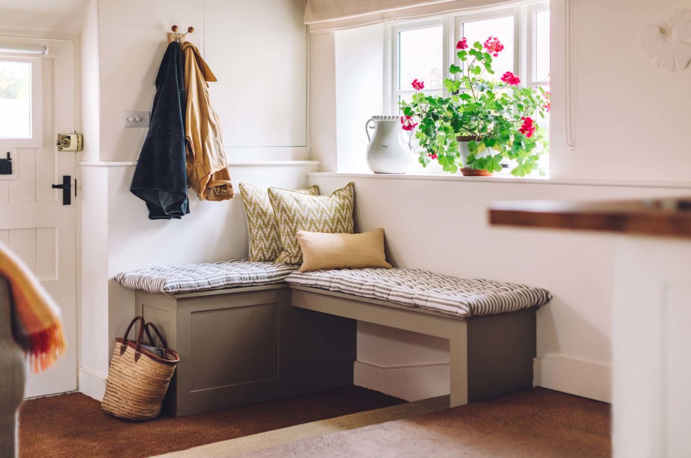Corner seating with cushions by the door