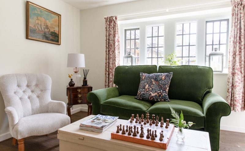 Green velvet sofa living room with chessboard