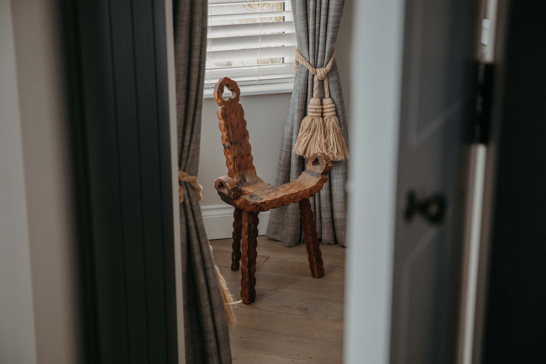 Folk wooden chair by a window