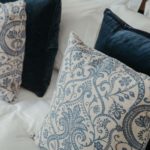 Close up of blue and white decorative cushions
