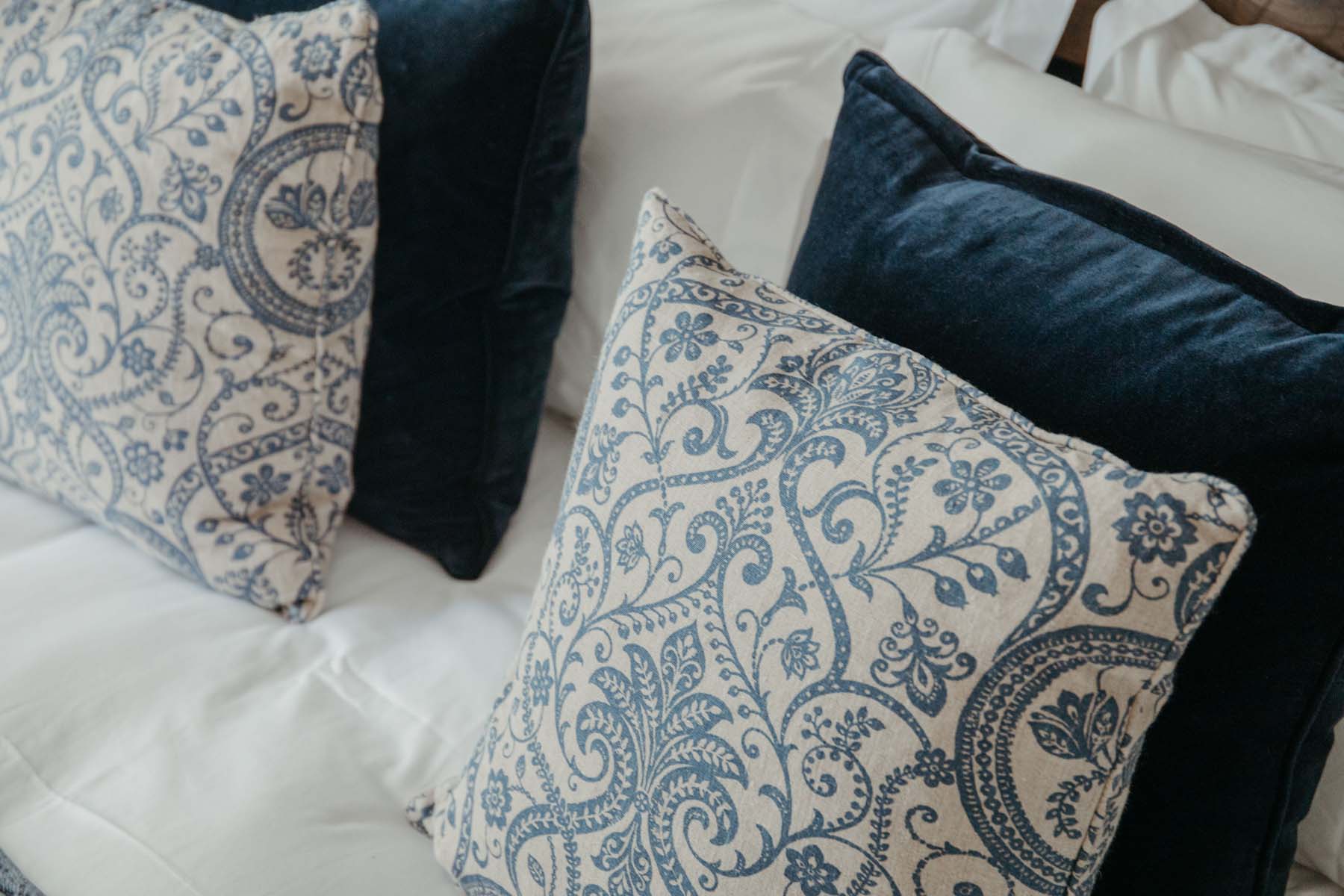 Close up of blue and white decorative cushions