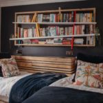 Kids bedroom with bookshelves on the wall