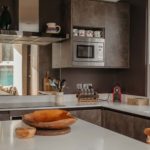Modern kitchen with grey tones and a white counter