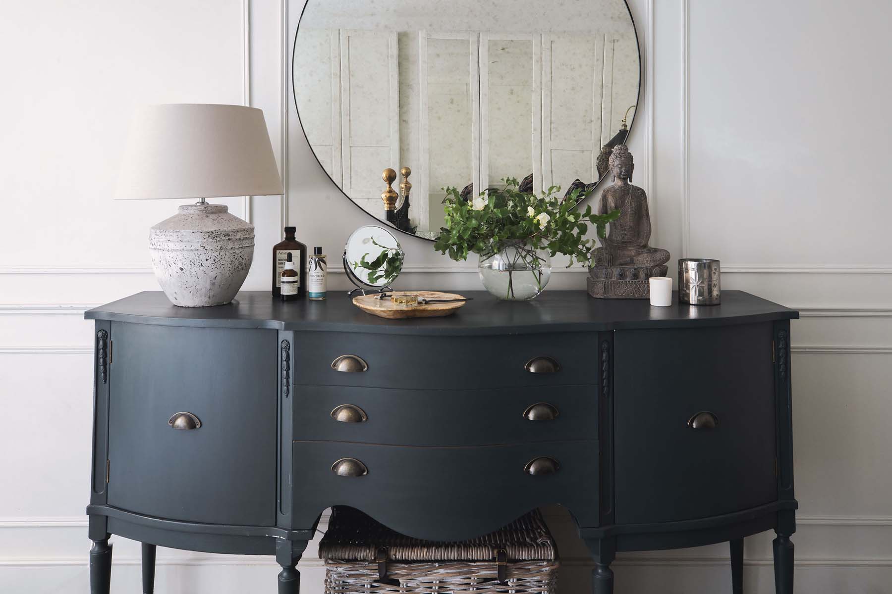 dressing table with large round overhead mirror