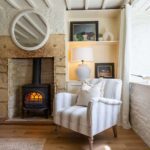 armchair next to fire in sitting room