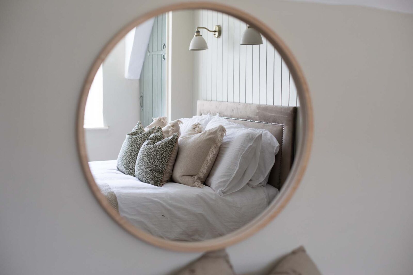 bed reflection in mirror